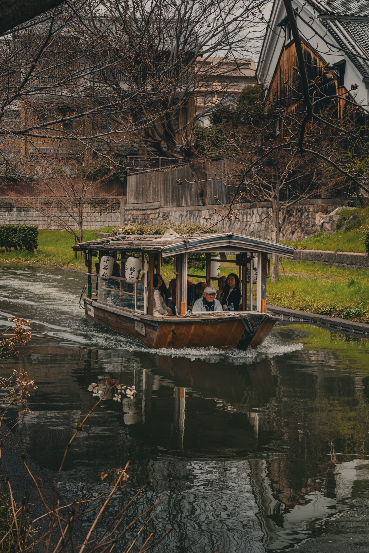 Traditional wooden boat on a Kyoto canal