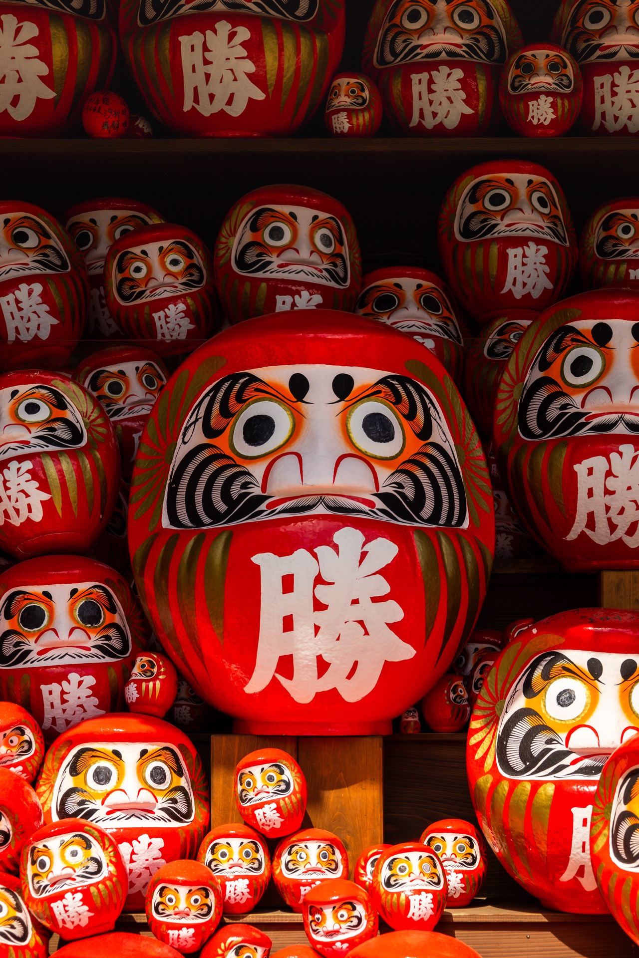 Collection of red Daruma dolls