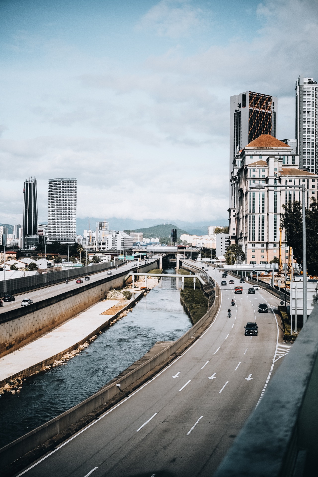 Kuala Lumpur city skyline with highway and river
